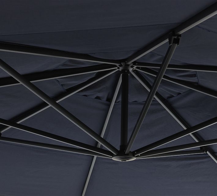 black closed patio umbrella Automatic with Remote Control ensuring you and your guests remain comfortable during outdoor gatherings Amalfi Fabric with Piping /